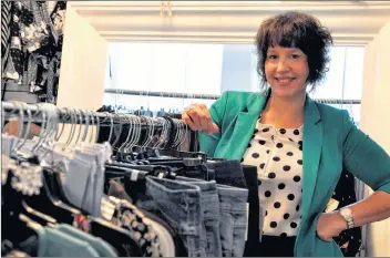  ??  ?? Liz Huntley stands inside her newly opened LIV Fashion Boutique shop in Kentville, located at 294 Main Street.