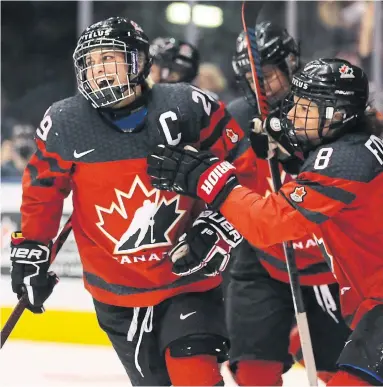  ?? RICHARD LAUTENS TORONTO STAR ?? Captain Marie-Philip Poulin, left, celebrates with teammates after scoring in Canada’s 4-3 win over the U.S. at Scotiabank Arena on Thursday night. Jamie Lee Rattray, Laura Fortino and Brianne Jenner had the other goals for Canada. Story, S4