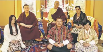  ??  ?? The Karmapa Thaye Dorje (second left) and his parents Mipham Rinpoche (centre/top), Dechen Wangmo Bottom (right/rear), Rinchen Yangzom (left) and her parents Chencho (centre/front) and Kunzang as they pose in New Delhi. — AFP photo