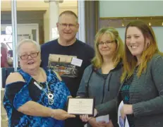  ??  ?? Director of Palliser Regional Library Jan Smith presents the @017 Branch of the Year award to Wood Mountain Palliser Library.