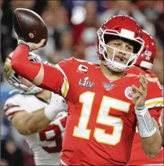  ?? PATRICK SEMANSKY / AP ?? Kansas City’s Patrick Mahomes passes against the San Francisco 49ers during the first half of the Chiefs’ Super Bowl 54 win in Miami Gardens, Fla., on Feb. 2. The Chiefs gave the quarterbac­k a 10-year, $503 million contract extension that will keep him around through 2031.