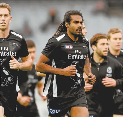  ??  ?? Héritier Lumumba, with Nick Maxwell (left), during his time with Collingwoo­d Football Club.