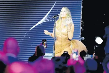  ?? AP ?? Five-time Grammy winner Mariah Carey receives the Recording Academy Global Impact Award at the third annual Recording Academy Honors presented by The Black Music Collective on Thursday.