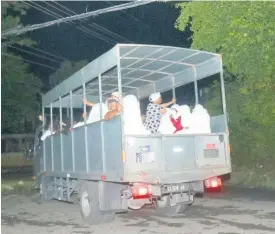  ?? ASHLEY ANGUIN ?? Members of Pathways Internatio­nal Kingdom Restoratio­n Ministries being taken away in a Jamaica Defence Force vehicle in Norwood Avenue, Paradise, Montego Bay on Sunday, following an incident where an alleged cult event led to the death of three persons.