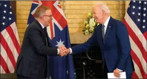  ?? (AP/Evan Vucci) ?? President Joe Biden (right) shakes hands with Australian Prime Minister Anthony Albanese during the Quad leaders summit meeting Tuesday at Kantei Palace in Tokyo.