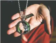  ?? SCOTT MCINTYRE/THE NEW YORK TIMES, FILE ?? Kimberlin Nickles displays a locket with a photograph of her daughter, Chasity Glisson, in Fort Lauderdale, Fla., on Dec. 19, 2017. Glisson left her Lexus running in the garage and was killed after carbon monoxide filled her home.