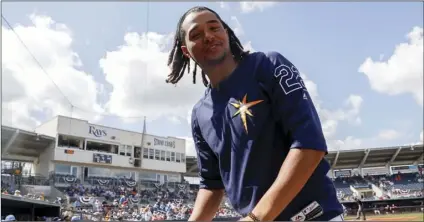  ?? PHOTO/JOHN MINCHILLO ?? Tampa Bay Rays’ Chris Archer reacts in the dugout in the third inning of a spring game against the Baltimore Orioles on Tuesday in Port Charlotte, Fla. AP