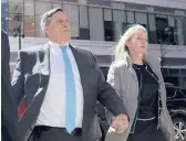  ?? CHARLES KRUPA/AP 2019 ?? John Wilson, shown with his wife, Leslie, is accused of paying more than $1.2 million in bribes to get his three children admitted to Harvard and Stanford.