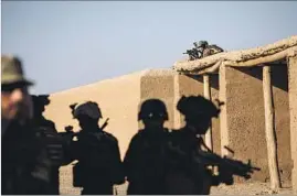  ??  ?? AFGHAN troops run through drills at Camp Shorab. Since the Marines arrived, Afghan forces have driven the Taliban away from highways and major towns.