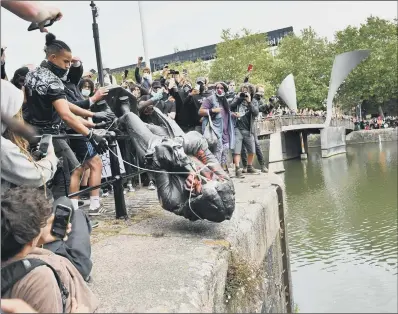  ?? PICTURE: BEN BIRCHALL/PA WIRE ?? FLASHPOINT: The statue of slave trader Edward Colston was dumped in Bristol Harbour by Black Lives Matter protesters.