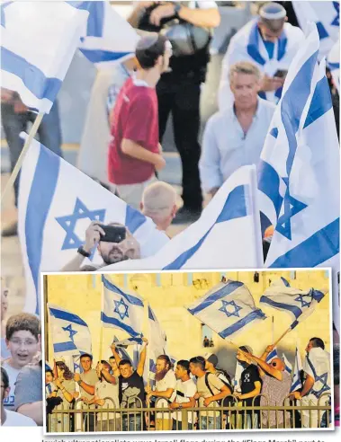  ?? Picture: AP ?? Jewish ultranatio­nalists wave Israeli flags during the “Flags March” next to Damascus gate, outside Jerusalem’s Old City on Tuesday.
