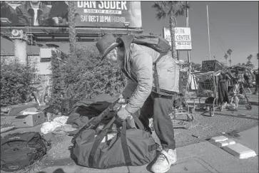  ?? Allen J. Schaben Los Angeles Times ?? CLYDE HARDY at an encampment next to the 10 Freeway. A proposed revision to L. A.’ s anti- camping law would allow authoritie­s to remove homeless camps anywhere in the city if they f irst offer alternativ­e shelter.
