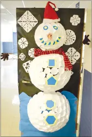  ?? Westside Eagle Observer/MIKE ECKELS ?? Allie Wood’s class won second place in the Winter Door Decorating Contest Dec. 17 at Decatur High School in Decatur.