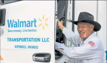  ?? AUSTIN FLESKES / Loveland Weekly ?? Warren Greeno stands outside of a Walmart transporta­tion truck at the Walmart Distributi­on Center in Loveland on Oct. 21 as he became the first Walmart long-distance truck driver to reach 5 million miles accident free.