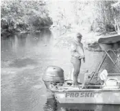  ??  ?? Jennifer Carr, president of the FloridaDef­enders of the Environmen­t, stands in a boat as it arrives at Cannon Springs of theOcklawa­ha River.