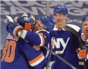  ?? DENNIS SCHNEIDLER/USA TODAY SPORTS ?? Islanders center Casey Cizikas (53) celebrates with goaltender Ilya Sorokin (30) after defeating the Flyers on Thursday.