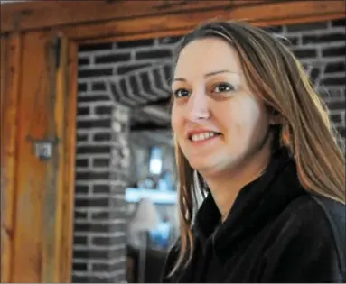  ?? JOHN STRICKLER — THE MERCURY ?? A smiling Michele Labant watches as Home Depot employees get to work doing renovation work to her Pottstown home. Labant was injured while deployed in Afghanista­n with the Pa. Army National Guard.