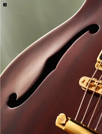  ??  ?? 2. Guild typically used laminated mahogany for the bodies on its original semis like this – that’s replicated here. You can also see the two-piece stacked block under the bridge and tailpiece through this f-hole 2