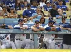  ?? BAKER PHOTO/MICHAEL OWEN ?? FROM LEFT: Los Angeles Dodgers’ Alex Verdugo, Chase Utley, Adrian Gonzalez and Alex Wood look on from the dugout during the ninth inning of their 8-1 loss to the Colorado Rockies during a baseball game, Sunday, in Los Angeles. AP