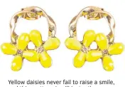  ??  ?? Yellow daisies never fail to raise a smile, and this pretty pair will instantly brighten your mood.
£15, oliverbona­s.com