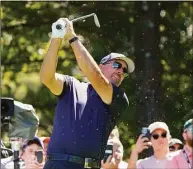  ?? Mary Schwalm / Associated Press ?? Phil Mickelson follows through on a tee shot on the second hole during the first round of the LIV Golf tournament Friday in Bolton, Mass.