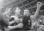  ?? [AP PHOTO] ?? Croatia’s Mario Mandzukic, center, celebrates after scoring his side’s second goal during the semifinal match against England at the World Cup on Wednesday in Moscow, Russia.
