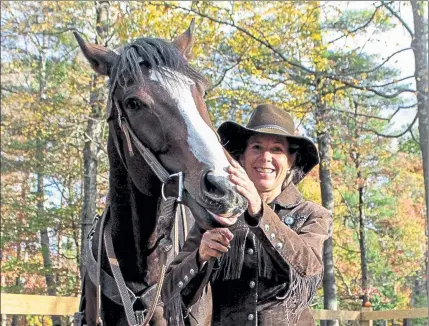  ?? COURTESY JASMINE NELSON ?? Susan Connell, founder, and owner of Cornerston­e Ranch in Princeton, is pictured with Dudley, one of her horses on the ranch.