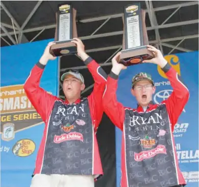  ?? (Photo by Ronnie Moore, B.A.S.S, for Starkville Daily News) ?? Jake Lee, left, and Jacob Foutz of Bryan College won the 2017 Carhartt Bassmaster College Series National Championsh­ip presented by Bass Pro Shops on Lake Bemidji out of Bemidji, Minn., with a three-day total weight of 49 pounds, 15 ounces.