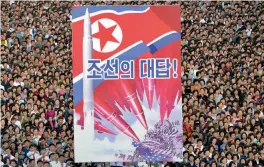  ?? — AFP ?? This picture taken on Saturday and released by North Korea’s official Korean Central News Agency on Sunday shows an anti-US rally in Kim Il-sung square in Pyongyang.