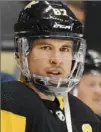  ?? Peter Diana/Post-Gazette ?? CROSBY CLOSE Sidney Crosby skates with the team for the first time in his return from sports hernia surgery in November.
Story, Page D-5