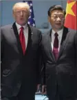  ?? SAUL LOEB/POOL PHOTO VIA AP ?? US President Donald Trump and Chinese President Xi Jinping (right), arrive for a meeting on the sidelines of the G-20 Summit in Hamburg, Germany on Saturday.