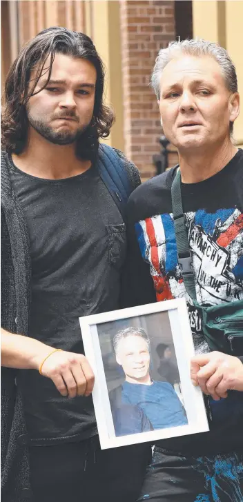  ?? Picture: AAP IMAGE ?? CLOSURE: Daniel Sims (left) and Dustin Mileham hold a photo of their murdered brother Donovan Mileham outside the Supreme Court in Sydney yesterday.