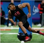  ?? ?? Georgia defensive lineman Travon Walker runs a drill during the NFL football scouting combine, Saturday, March 5, 2022, in Indianapol­is. Walker is expected to be taken in the NFL Draft.