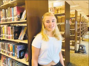  ?? Kate Farrish Conn. Health I-Team / ?? Sabrina Sault, 18, of Vernon, is a Rockville High School senior and cheerleade­r who says she has nearly stopped vaping after about three years. Pictured at the Rockville Public Library, she said that if she could, she would tell herself to “stop before it got to be too much.”