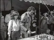  ?? AJC ARCHIVE ?? Burt Reynolds and his “Smokey and the Bandit” co-star Sally Field celebrated his birthday while filming in Atlanta.