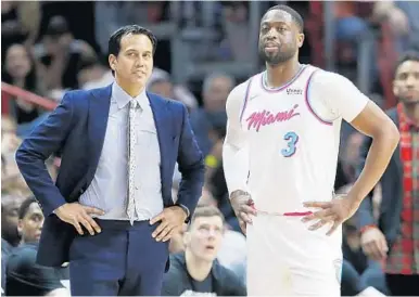  ?? WILFREDO LEE/AP ?? Miami Heat guard Dwyane Wade (3) and coach Erik Spoelstra will be leading the team for its final 24-game push for the playoffs beginning a week from today.