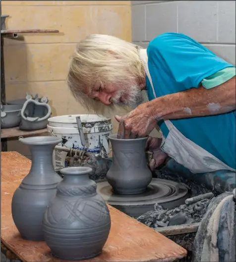  ?? (Arkansas Democrat-Gazette/Cary Jenkins) ?? James Kimberly “Kimbo” Dryden throws a pot at Dryden Pottery in Hot Springs. The potter was named the 2022 Arkansas Living Treasure by the Arkansas Arts Council.