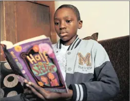  ??  ?? Morris, who was diagnosed a year ago with acute myeloid leukaemia, remains resilient and full of the joys of life. Here he relaxes with a book.