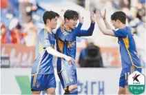  ?? Courtesy of the Korea Profession­al Football League ?? Lee Dong-gyeong of Ulsan HD FC, center, celebrates after scoring during a K League 1 football match against the Gangwon FC at Munsu Football Stadium in Ulsan, Saturday.