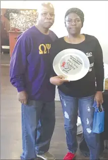  ?? Submitted Photo ?? Melvin Tinsley, left, is awarded by Connie Roebuck a plate for his 23 years of service to her group. Roebuck spearheads an HIV/AIDS Awareness group in the St. Francis County area that annually brings testing kits and informatio­n to the area.