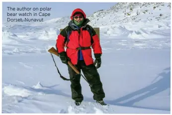  ??  ?? The author on polar bear watch in Cape Dorset, Nunavut.