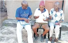  ??  ?? AUTHOR Fred Khumalo, left, with childhood friends Senzo Khumalo, centre, and Sizwe Mkhwanazi during a visit back to his roots in Hammarsdal­e, Kwazulu-natal.