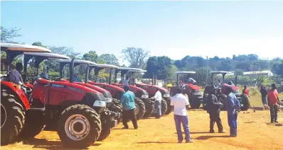  ??  ?? CHIPINGE macadamia farmers received a shot in the arm last Saturday after a local company, Cropate Agricultur­al Services availed 10 tractors to the farmers. The developmen­t is aimed at improving the quality of the country's macadamia nuts at...