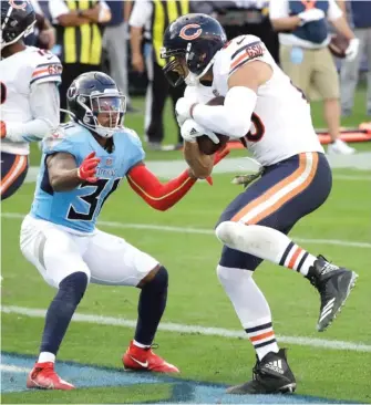  ?? BEN MARGOT/AP ?? Tight end Jimmy Graham, shown catching an eight-yard touchdown pass against the Titans on Nov. 8, is tied for second in the NFL with 13 targets inside the red zone.