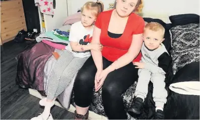  ??  ?? Wits’ end Pregnant mum Lauren Williamson with kids Grace, 7, and four-year-old Ryley in the living room where she and husband Lee sleep