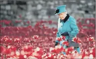  ?? PICTURE: PA WIRE ?? REMEMBRANC­E: The Queen visits the Tower of London’s Blood Swept Lands and Seas of Red installati­on in 2014.