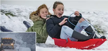  ??  ?? Sleigh day... Lois and Maggie Marshall made the most of the snow at Lickey Hills park in Birmingham, while a plough clears the way in Northumber­land