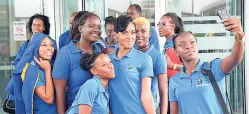  ?? IAN ALLEN/PHOTOGRAPH­ER ?? Members of the Barbados national netball team pose for pictures upon arrival at the Norman Manley Internatio­nal Airport yesterday for a series against Jamaica’s Sunshine Girls. The opening game takes place today at the National Arena at 7 p.m.