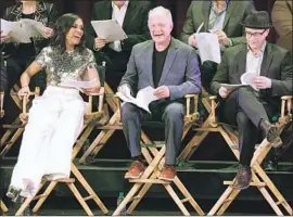  ?? Michael Tran Getty Images ?? “SCANDAL” cast members, including star Kerry Washington, Jeff Perry, center, and Joshua Malina, sit for a live reading of the series finale in Hollywood.