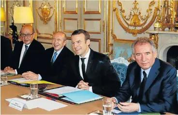  ?? /Reuters ?? New faces: French President Emmanuel Macron, second right, attends a cabinet meeting with his newly named ministers, Justice Minister Francois Bayrou, right, Interior Minister Gerard Collomb, second left, and Foreign and European Minister Jean-Yves Le Drian at the Elysee Palace in Paris on Thursday.